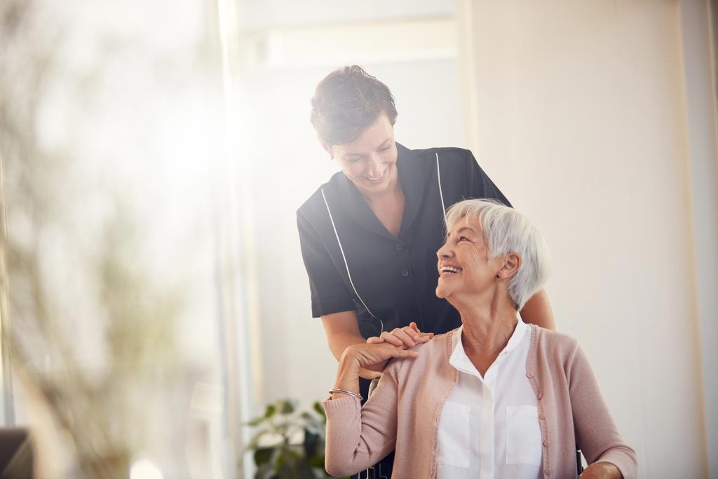 Support worker assisting a participant with daily living tasks during home care support