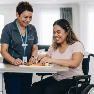 Participant being assisted with daily life skills